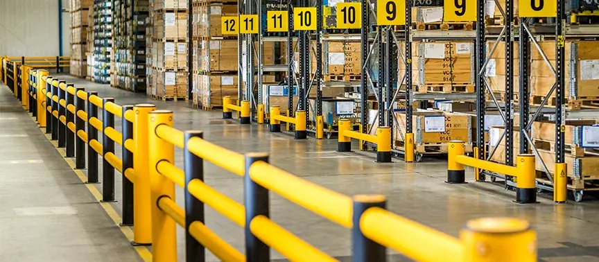 Yellow safety barriers in a warehouse