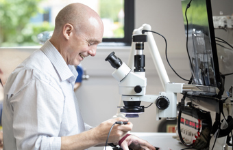 Man using microscope