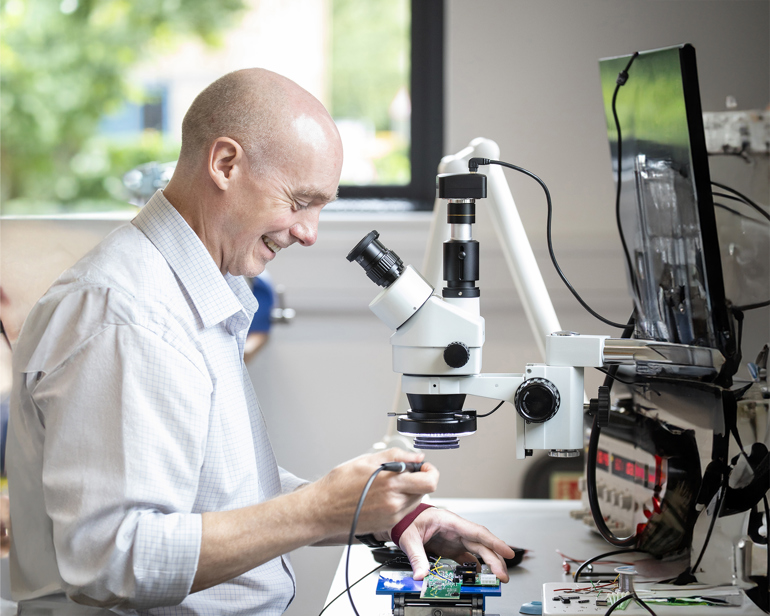 Man using microscope